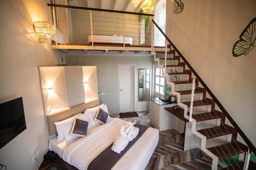 Postel nebo postele na pokoji v ubytování La Papillon Maison