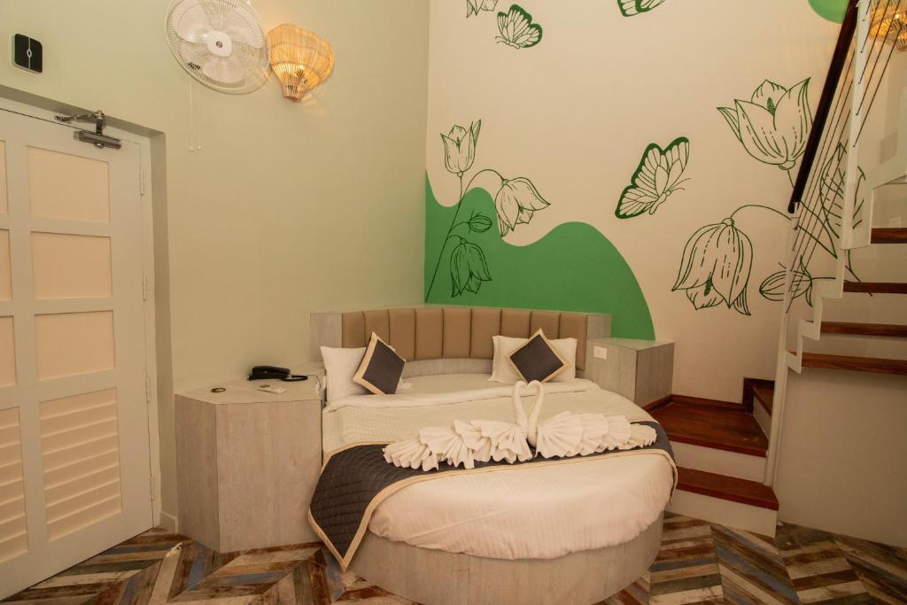 Postel nebo postele na pokoji v ubytování La Papillon Maison