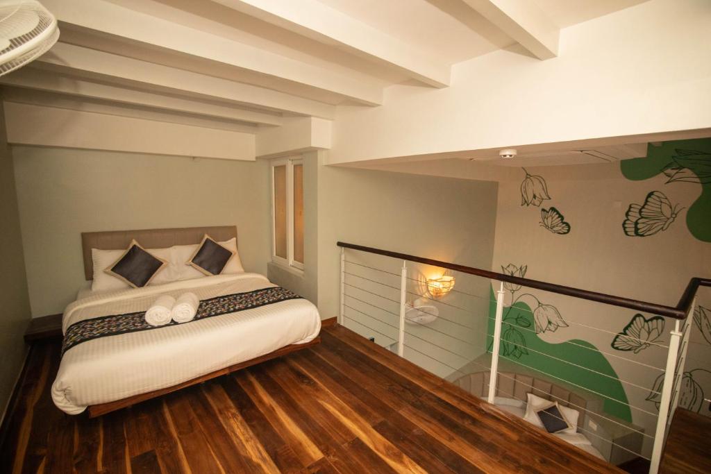 Postel nebo postele na pokoji v ubytování La Papillon Maison