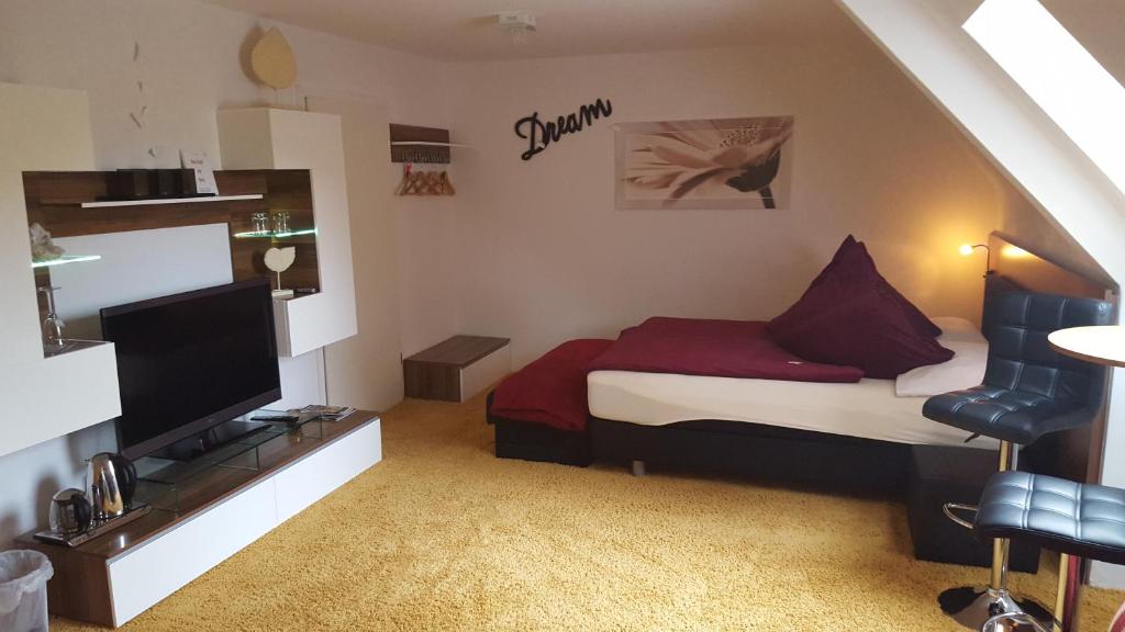 TV a/nebo společenská místnost v ubytování Gästezimmer Im Haus Am Wald