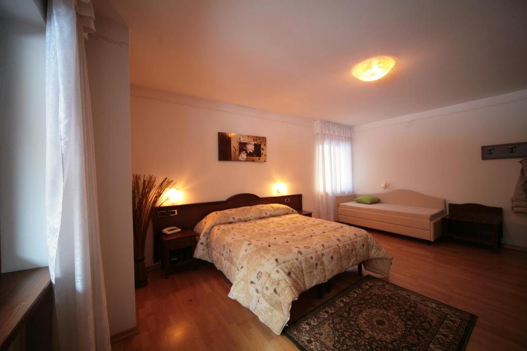 Postel nebo postele na pokoji v ubytování Hotel Marianna