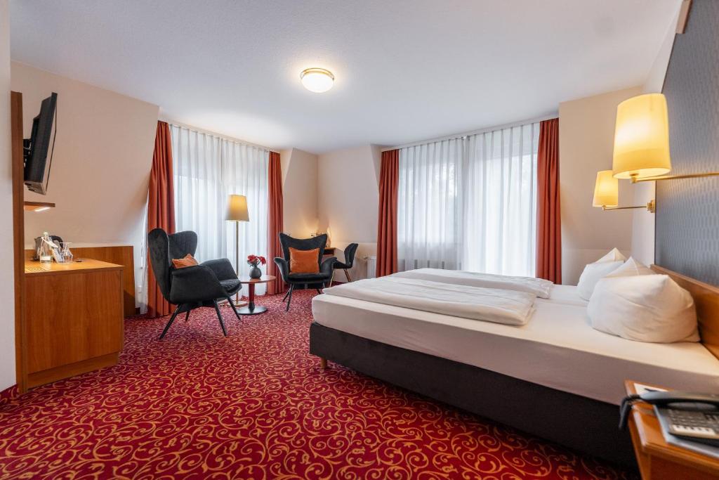 Postel nebo postele na pokoji v ubytování Hotel Alexa