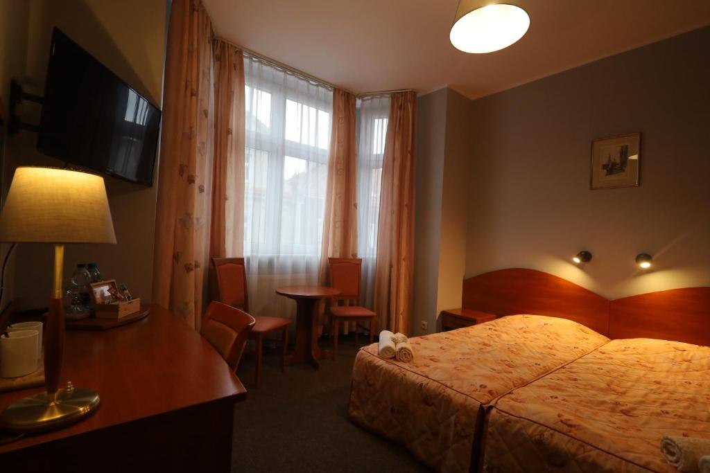 Posteľ alebo postele v izbe v ubytovaní Nasz Klub - Pokoje Gościnne