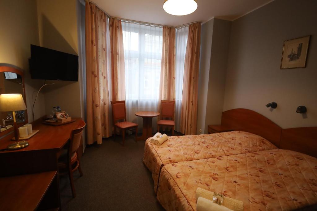 Posteľ alebo postele v izbe v ubytovaní Nasz Klub - Pokoje Gościnne