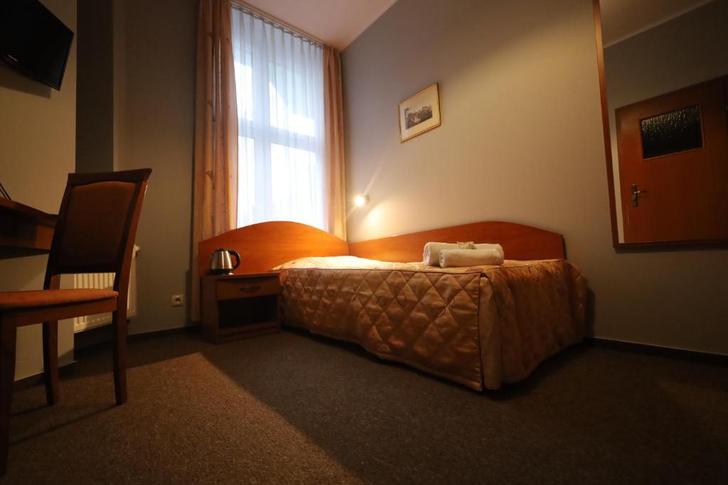 Posteľ alebo postele v izbe v ubytovaní Nasz Klub - Pokoje Gościnne