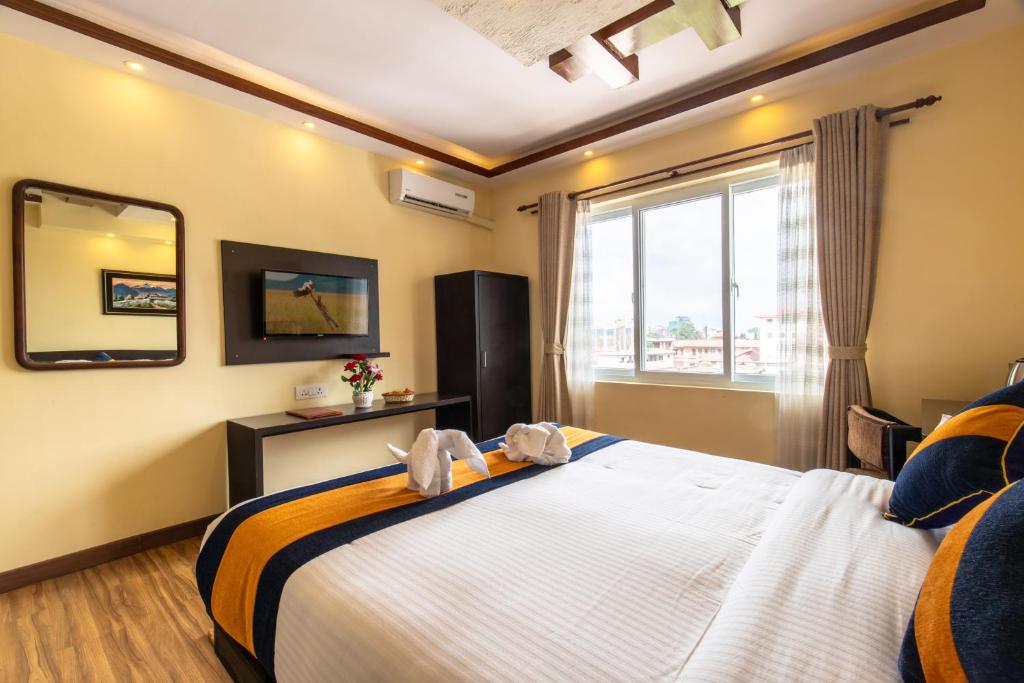 Postel nebo postele na pokoji v ubytování Devo Boutique Hotel