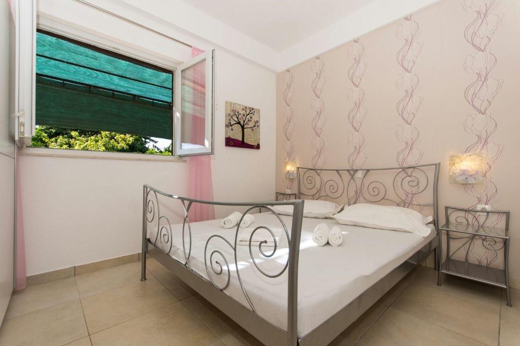 Postel nebo postele na pokoji v ubytování Apartment Bareta