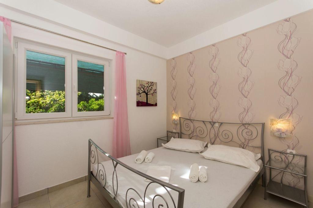 Postel nebo postele na pokoji v ubytování Apartment Bareta