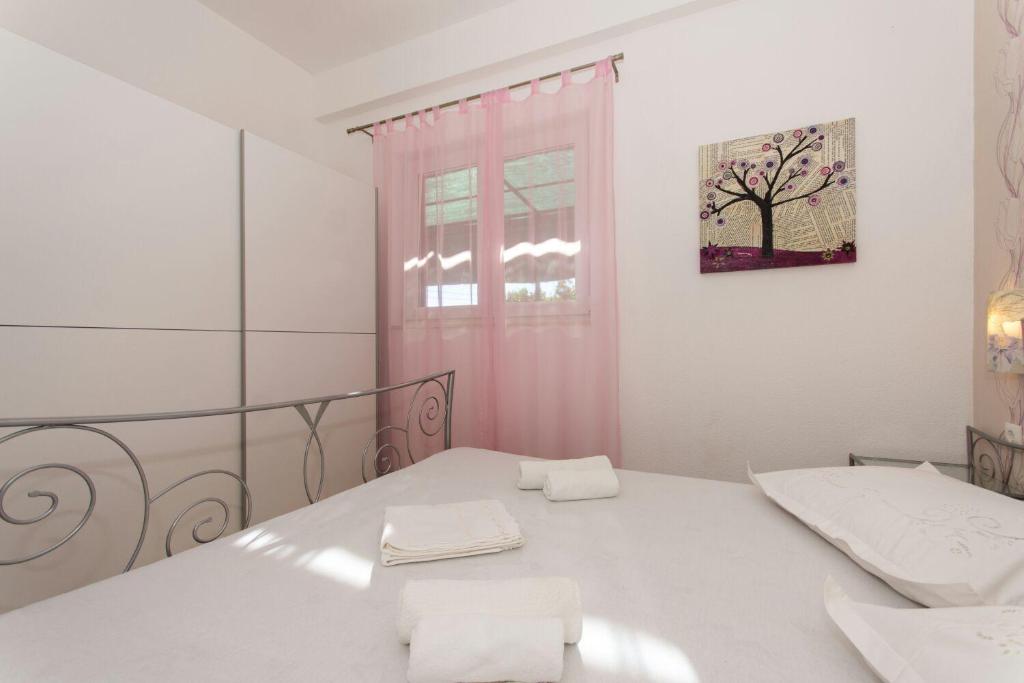 Postel nebo postele na pokoji v ubytování Apartment Bareta