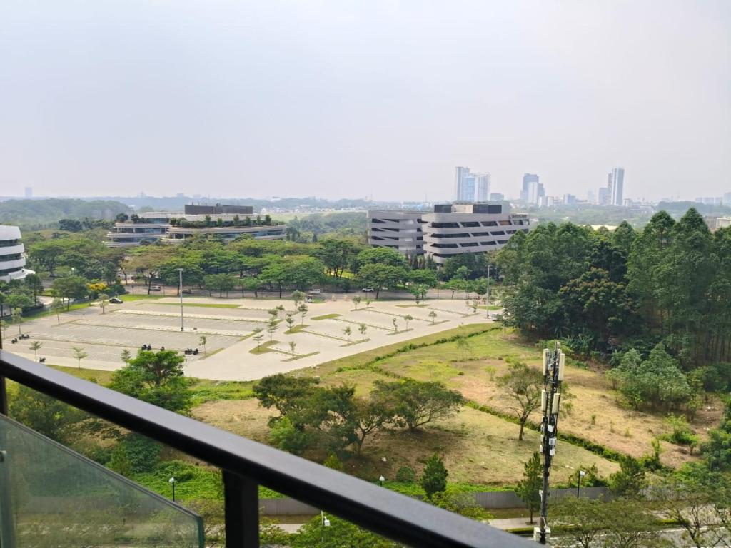 a view of a park with buildings in the background at Apartemen Sky House BSD in Cilenggang