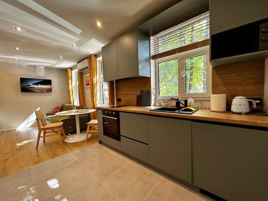 a kitchen with a sink and a counter top at 2nd floor Casa Kungu Street in Liepāja