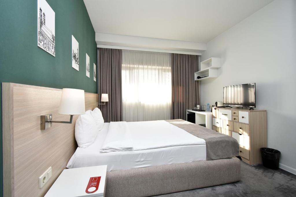 Postel nebo postele na pokoji v ubytování In City Hotel