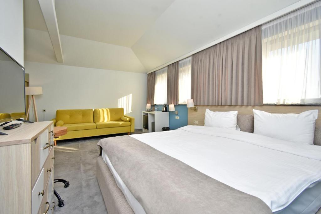 Postel nebo postele na pokoji v ubytování In City Hotel