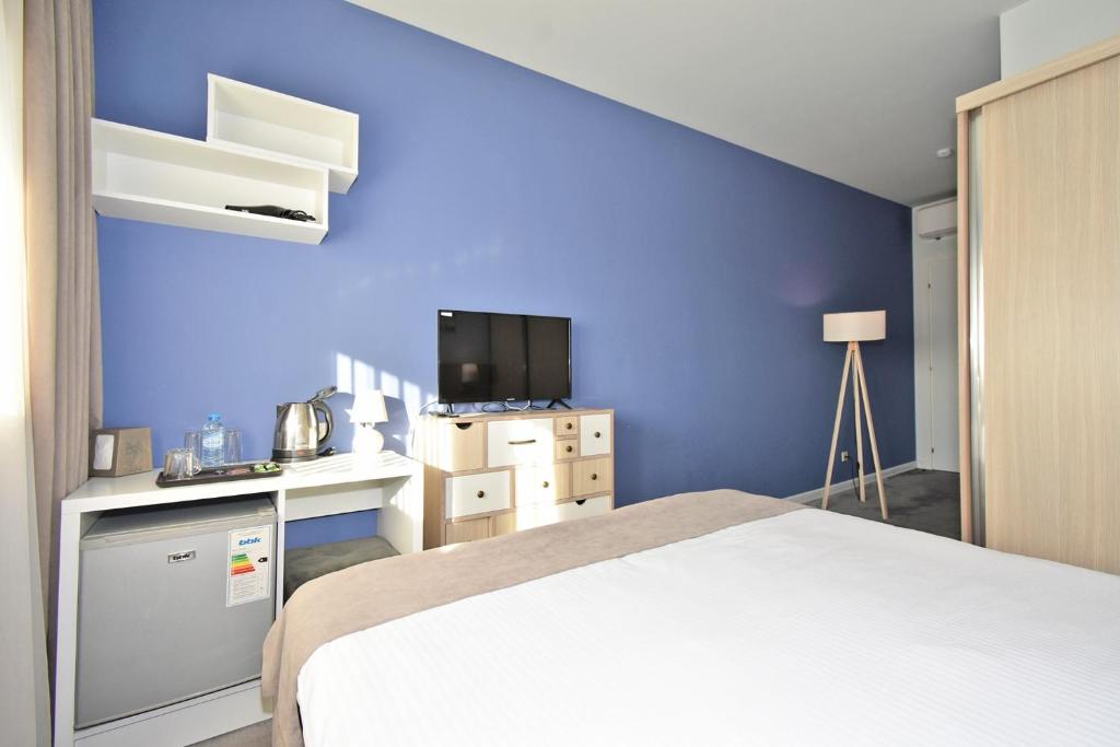 Postel nebo postele na pokoji v ubytování In City Hotel