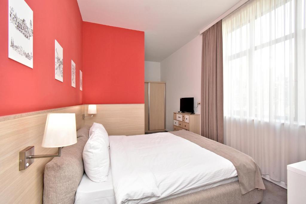 Postel nebo postele na pokoji v ubytování In City Hotel