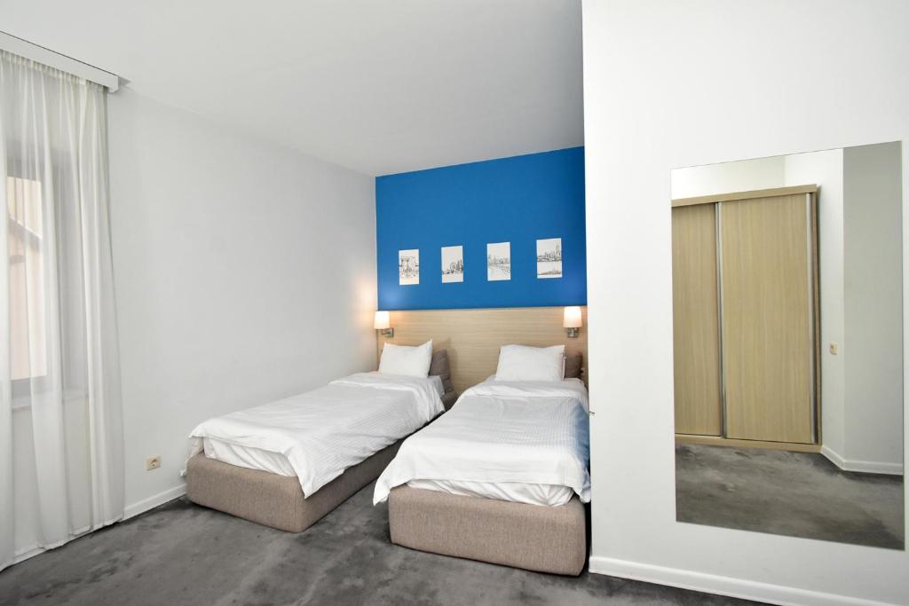 Postel nebo postele na pokoji v ubytování In City Hotel