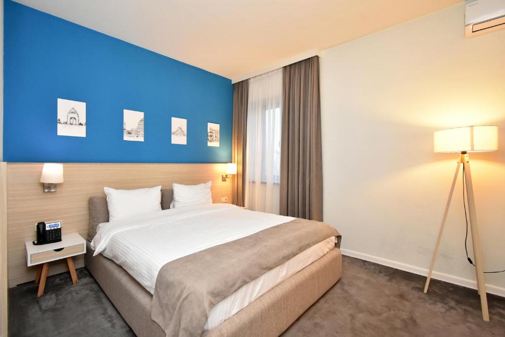 Postel nebo postele na pokoji v ubytování In City Hotel