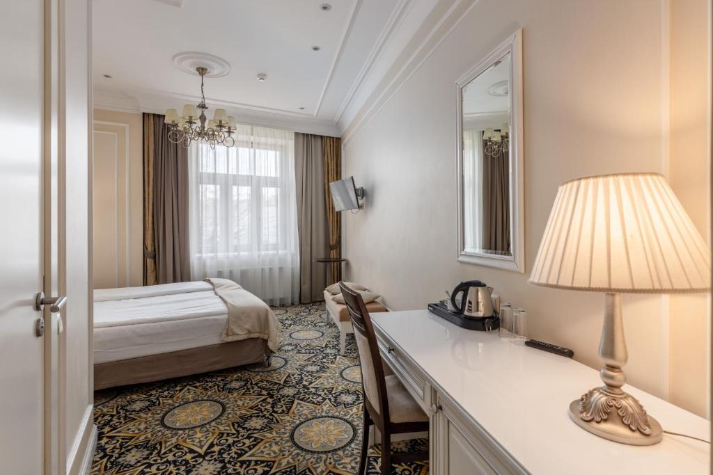 Gulta vai gultas numurā naktsmītnē Gertrude Hotel self check-in