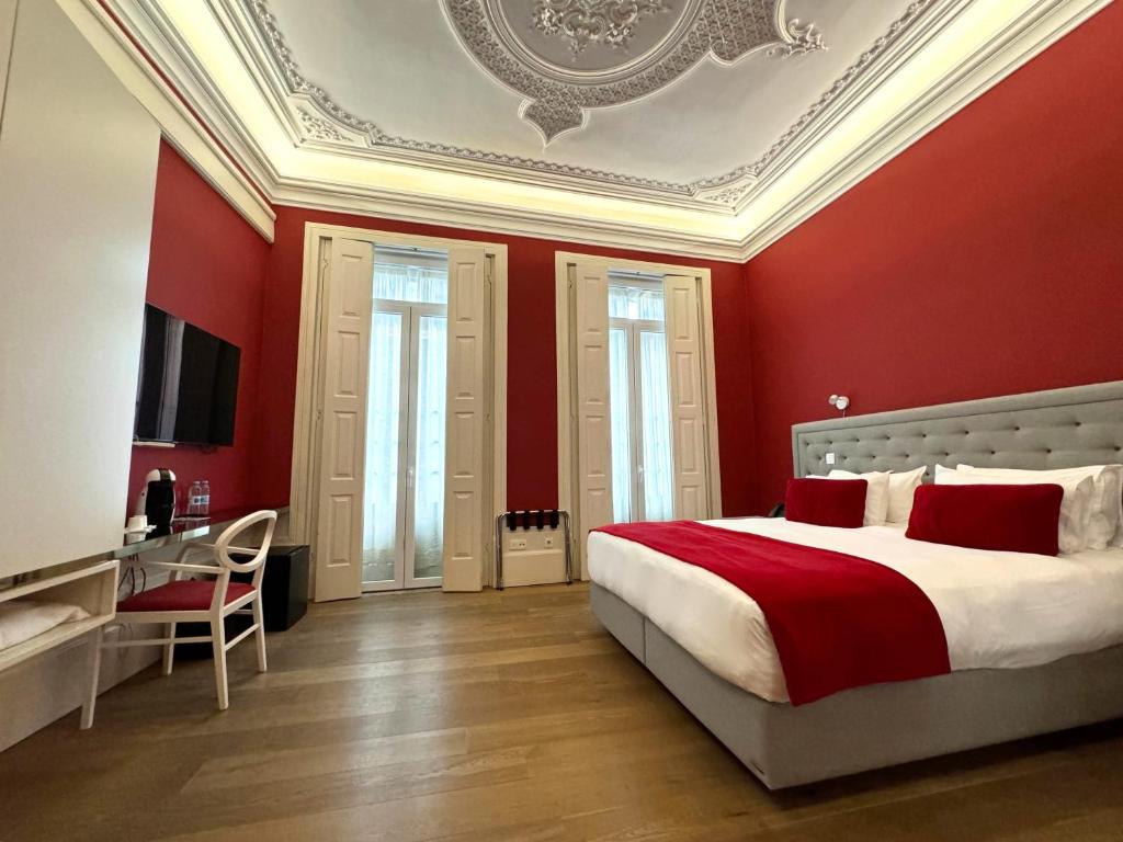 Postel nebo postele na pokoji v ubytování EMAJ Boutique Hotel