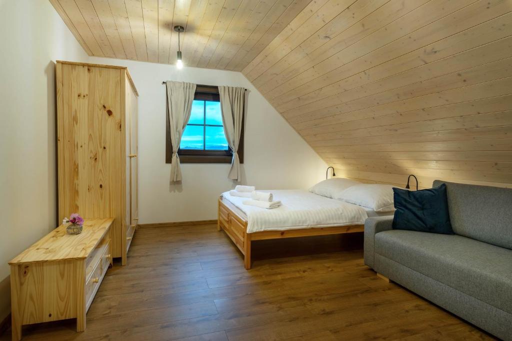 Postel nebo postele na pokoji v ubytování Chaty pri Mare - Tatralake houses