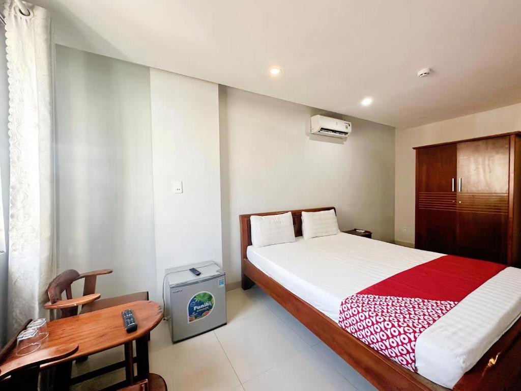 Postel nebo postele na pokoji v ubytování Huy Hoàng Hotel Đà Nẵng