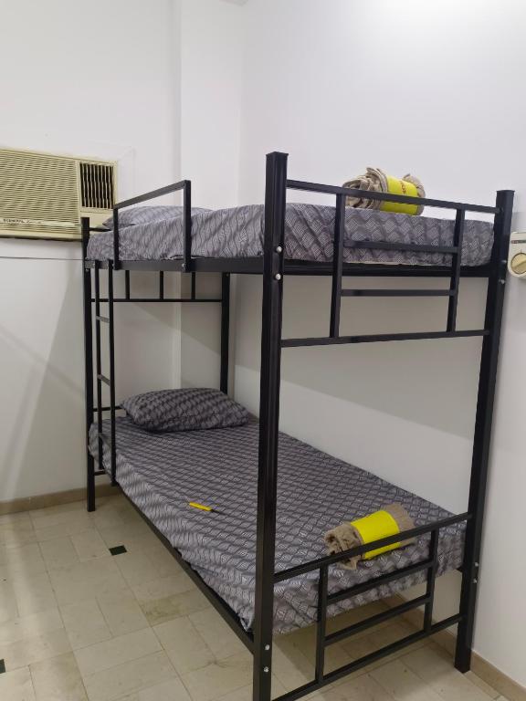 Postel nebo postele na pokoji v ubytování AL SHAMS MUSCAT MALE hostel
