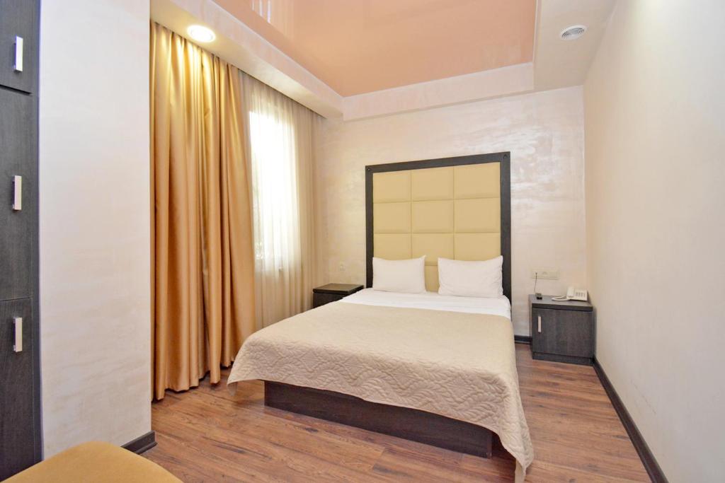 Postel nebo postele na pokoji v ubytování Partez Hotel