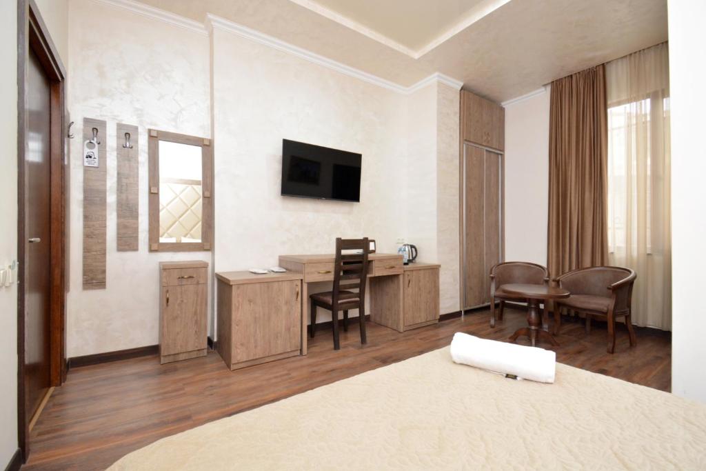 TV a/nebo společenská místnost v ubytování Partez Hotel