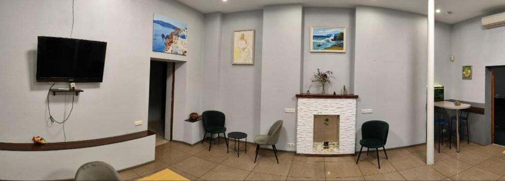TV a/nebo společenská místnost v ubytování Mini-Hotel Ocean