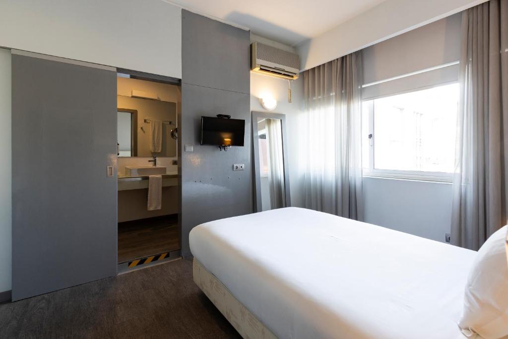 Een bed of bedden in een kamer bij Hotel Rali Viana