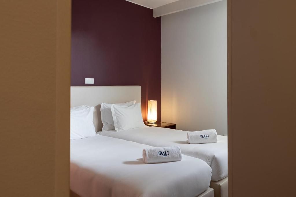 Een bed of bedden in een kamer bij Hotel Rali Viana