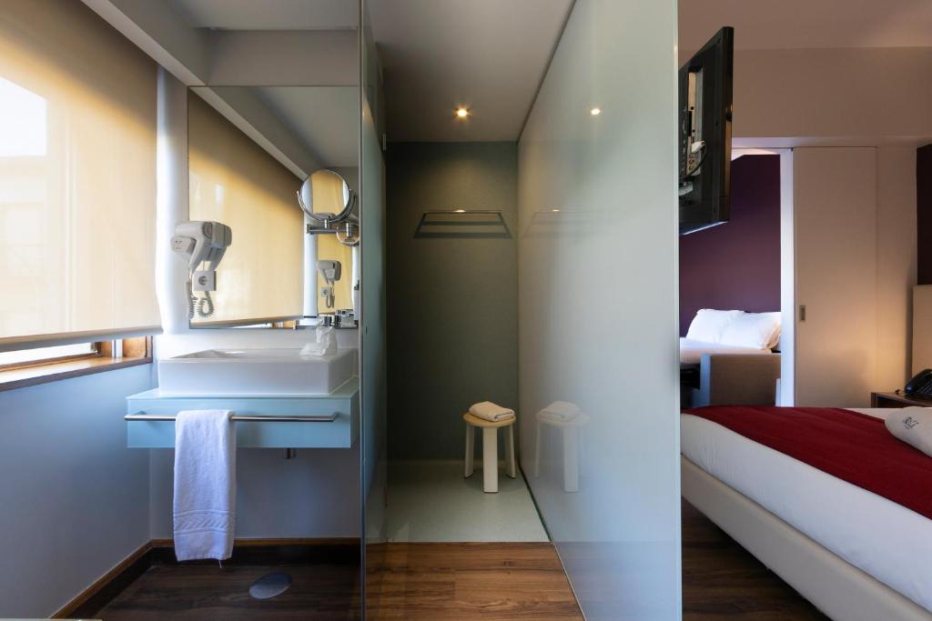 Een bed of bedden in een kamer bij Hotel Rali Viana