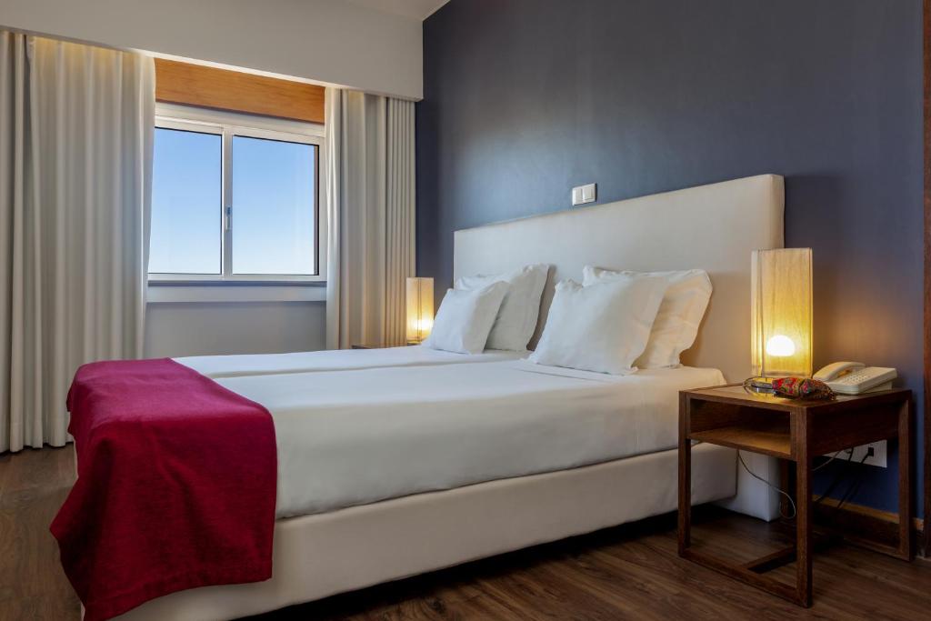 Een bed of bedden in een kamer bij Hotel Rali Viana