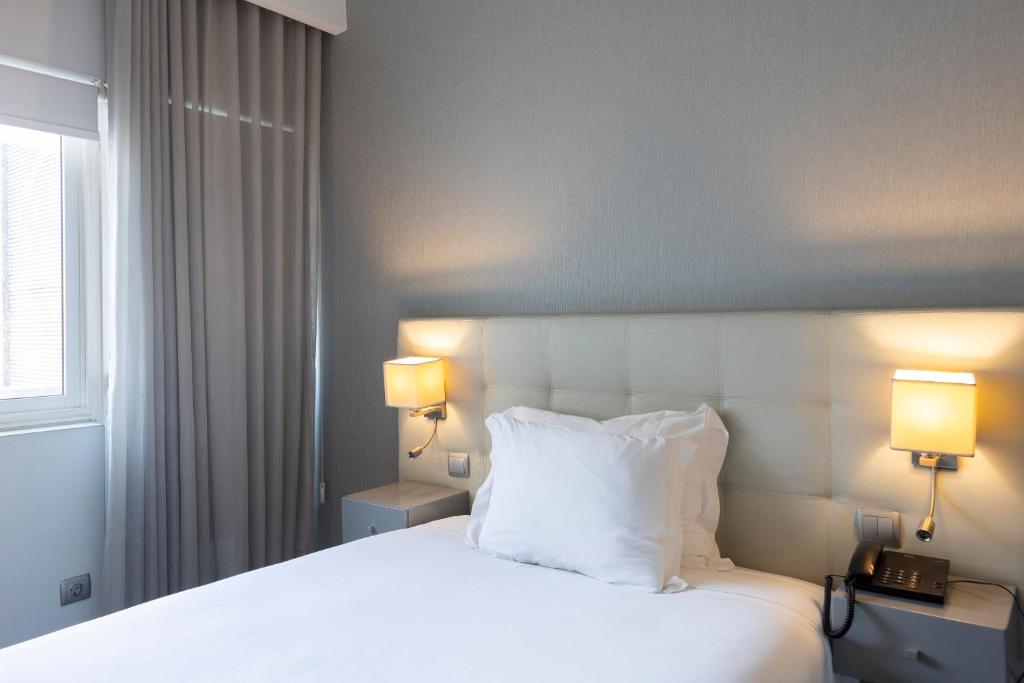 Een bed of bedden in een kamer bij Hotel Rali Viana