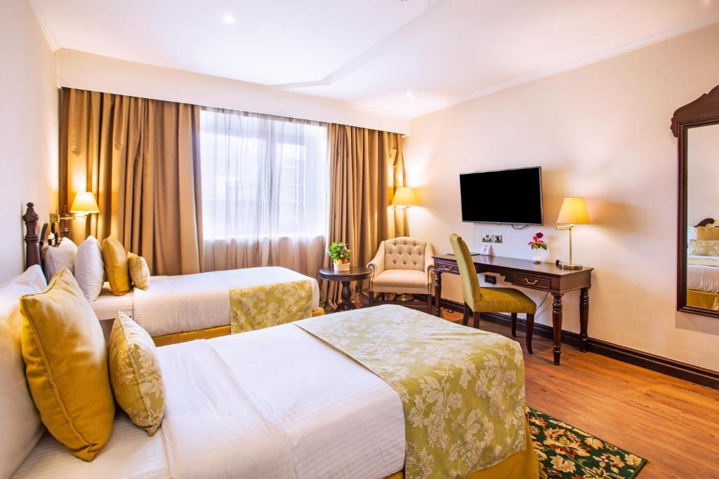 TV a/nebo společenská místnost v ubytování Midland Hotel Nakuru