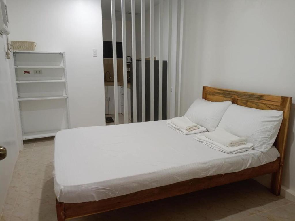 Postel nebo postele na pokoji v ubytování TD ROOMSTAY