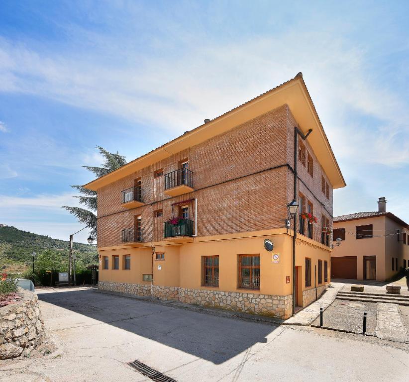 a large brick building with windows and balconies at Sierra de Arbe in Naval