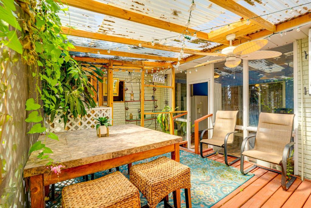 a patio with a table and chairs on a deck at Spacious Plant City Home 1 Mi to Dtwn in Plant City