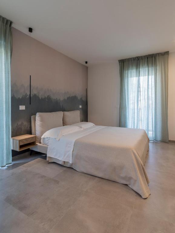 Łóżko lub łóżka w pokoju w obiekcie Residence Stella