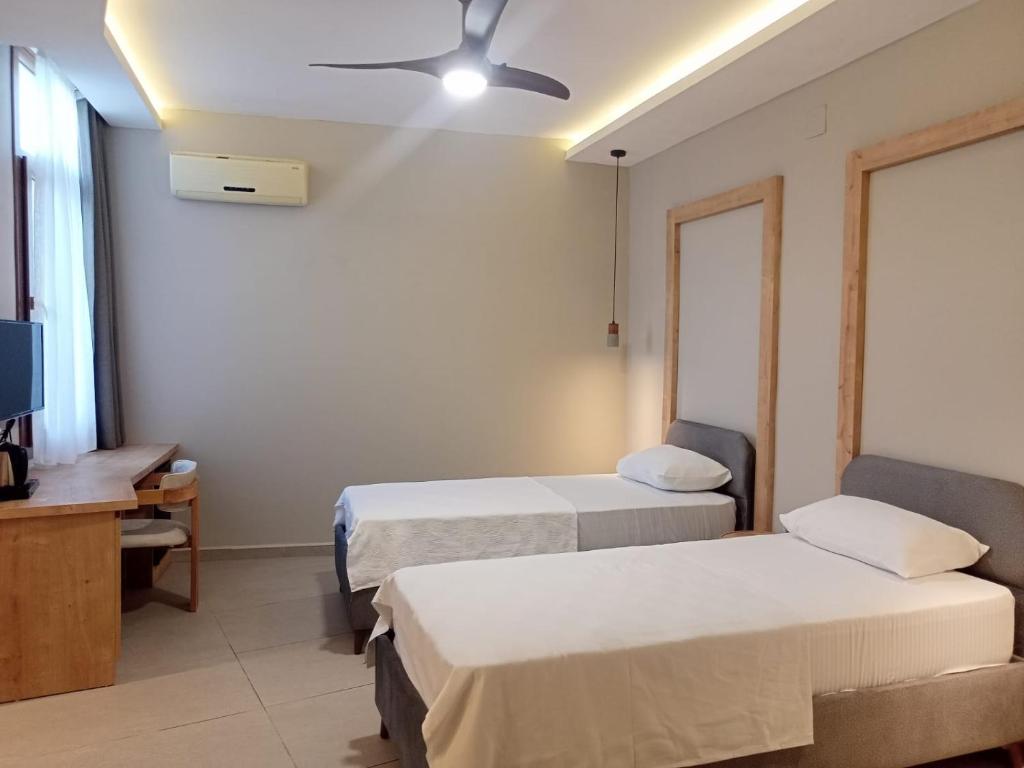 Postel nebo postele na pokoji v ubytování Casalita Hotel