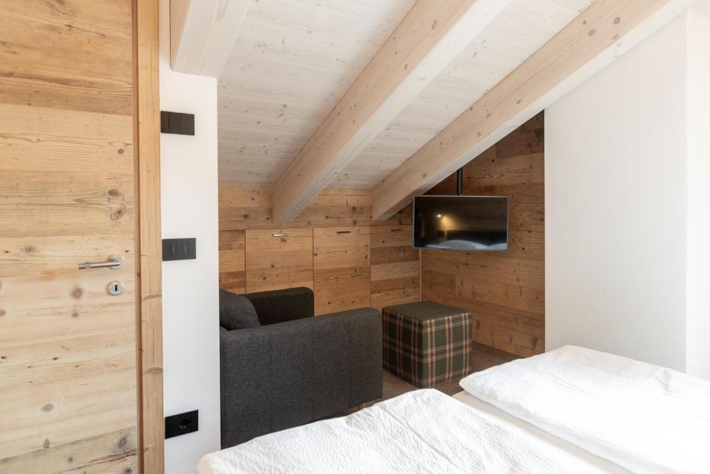 Voodi või voodid majutusasutuse BAITA LARIX BORMIO toas
