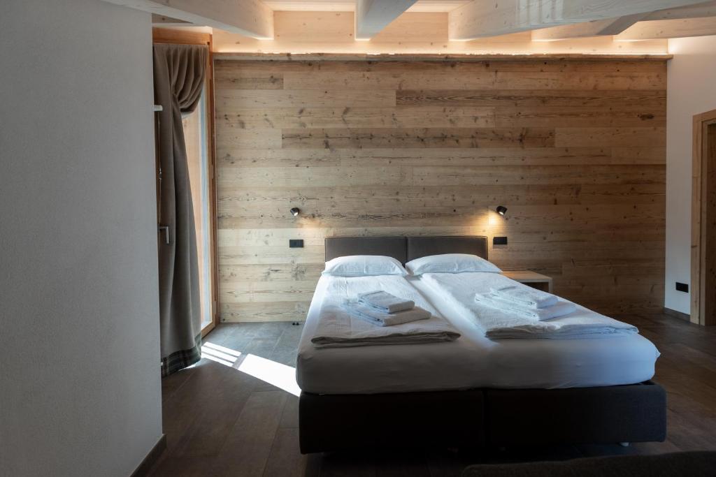 Voodi või voodid majutusasutuse BAITA LARIX BORMIO toas