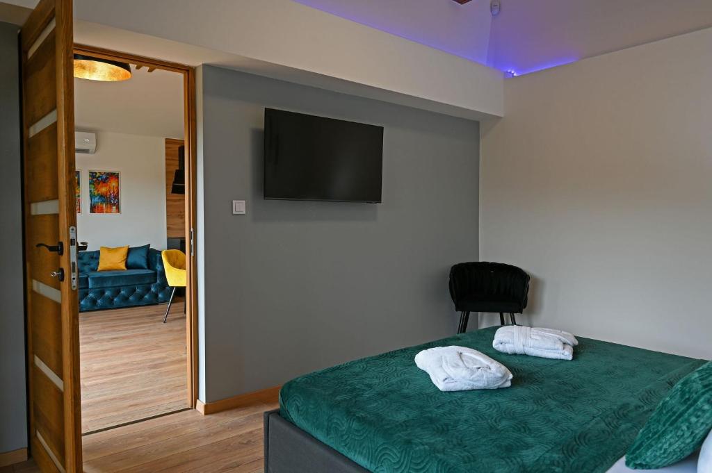 Postel nebo postele na pokoji v ubytování Mátra Forest Resort