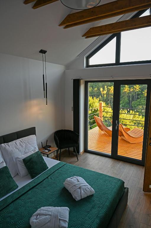 Postel nebo postele na pokoji v ubytování Mátra Forest Resort