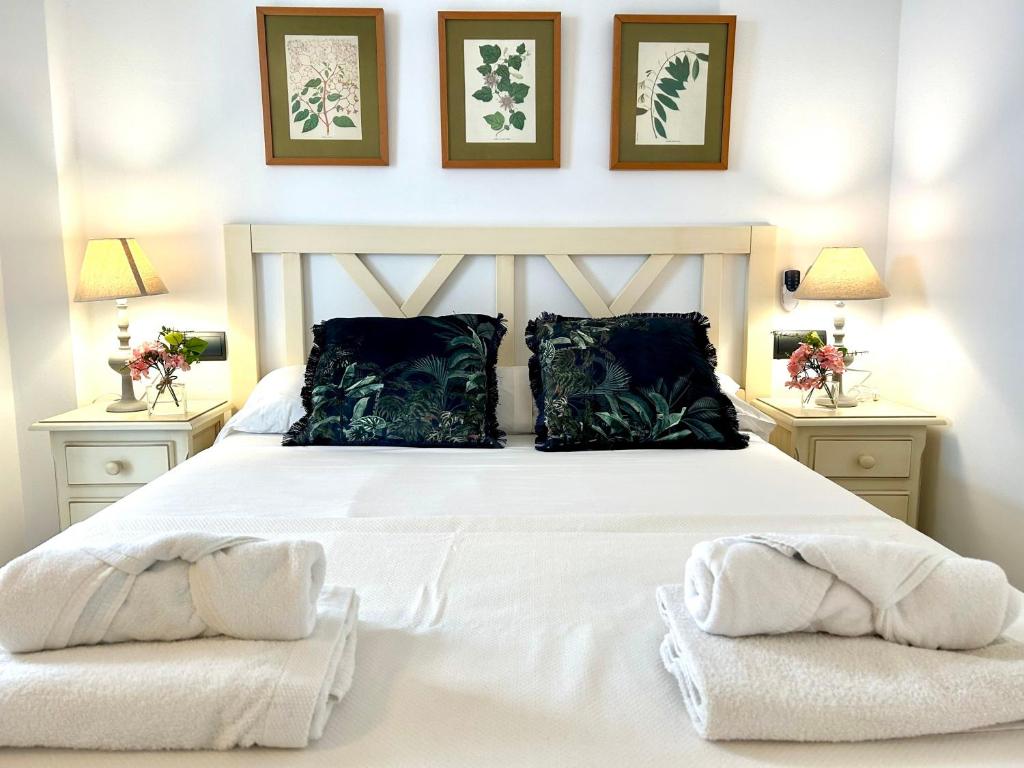 Кровать или кровати в номере GATU Faro con Parking gratis, "preferente para mayores de 21 años y familias "