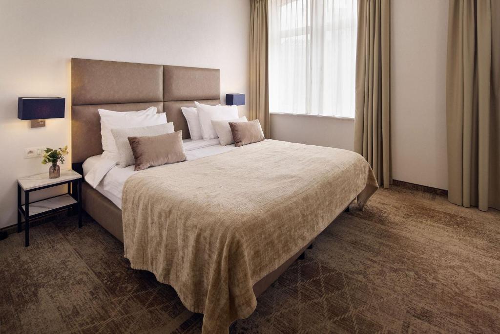 Postel nebo postele na pokoji v ubytování Van der Valk Hotel Mechelen
