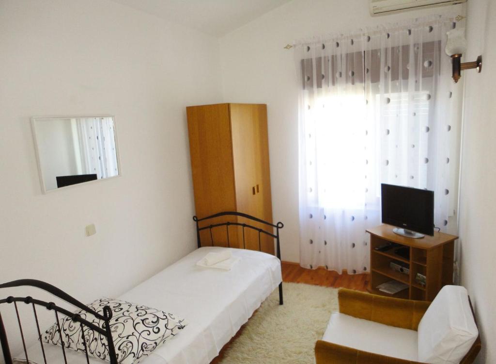 Posteľ alebo postele v izbe v ubytovaní Apartments Bozana