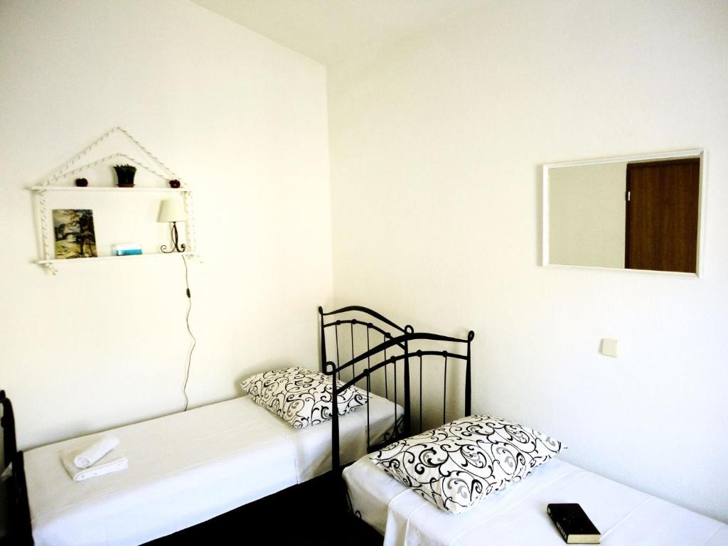 Posteľ alebo postele v izbe v ubytovaní Apartments Bozana