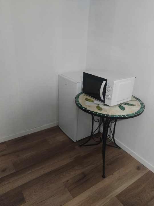 TV a/nebo společenská místnost v ubytování chambres d'hôtes rue Pasteur