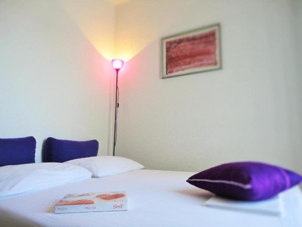 Posteľ alebo postele v izbe v ubytovaní Apartments Bozana